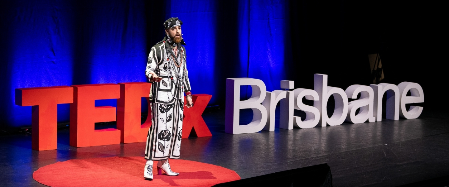 Atlantic Fellow for Health Equity Global Jordi Luke on stage at TEDxBrisbane