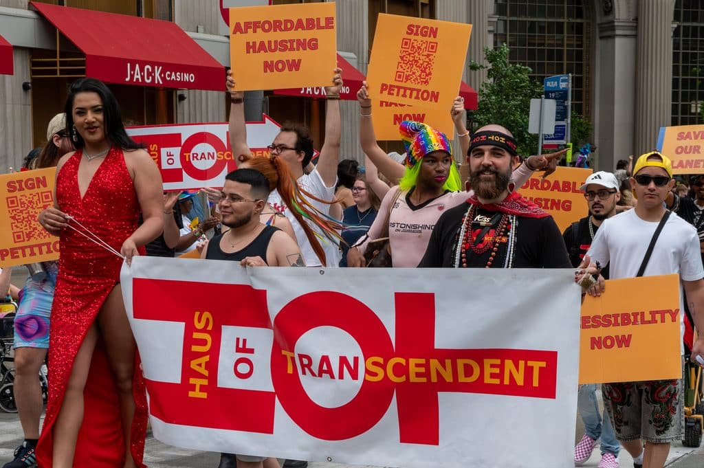 Haus of Transcendent marchers carrying a HOT banner and Affordable Hausing Now signs at the Cleveland Pride Parade